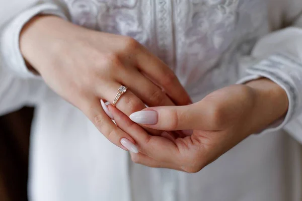 Picture of man and woman with wedding ring.Young married couple holding hands, ceremony wedding day. Newly wed couples hands with wedding rings.