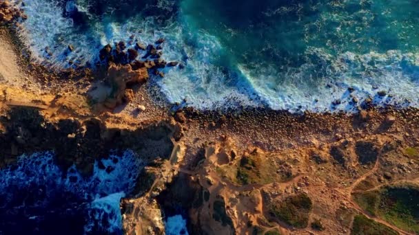 Aerial Top View Sea Waves Break Rocky Shores Drone Shot — Stock Video