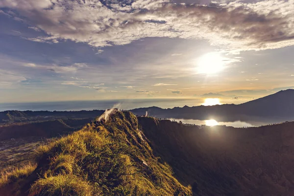 stock image Breathtaking sunrise over Abang mountain, view from Batur volcano and Batur lake, Bali, Indonesia