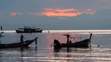 Spectacular sunset with boats in the sea, Koh Tao, Thailand