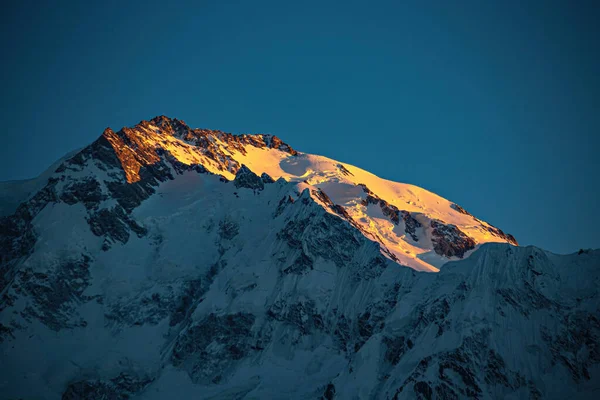 Summit of Nanga Parbat mountain lit with the sun in the morning, Pakistan
