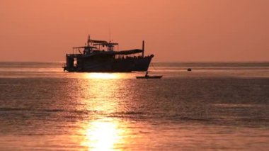 Spectacular sunset with boats in the sea, Koh Tao, Thailand