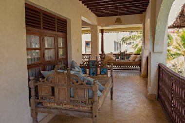 Luxury hotel, villa, guesthouse interior with sofa on the terrace in Lamu, Kenya