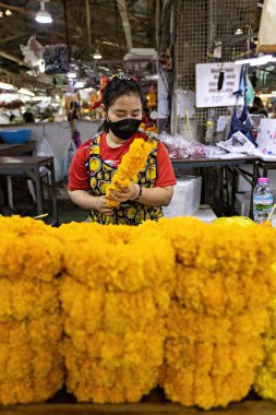 People working on the flower market in Bangkok Thailand