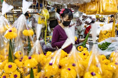 People working on the flower market in Bangkok Thailand