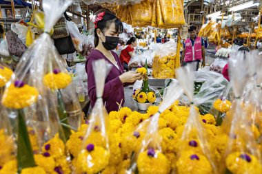 People working on the flower market in Bangkok Thailand