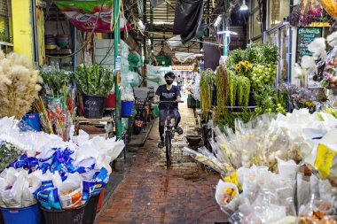 People working on the flower market in Bangkok Thailand