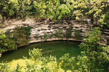 Cenote at Chichenitza ruins ancient pre-colombian city in Yucatan, Mexico