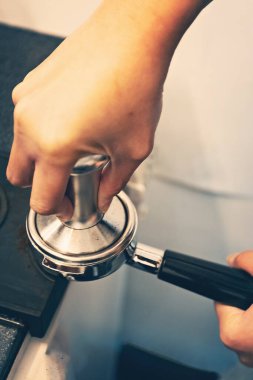 Barista prepearing coffee hands close up
