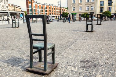 Ghetto heroes square with lots of symbolic chairs in Krakow, Poland