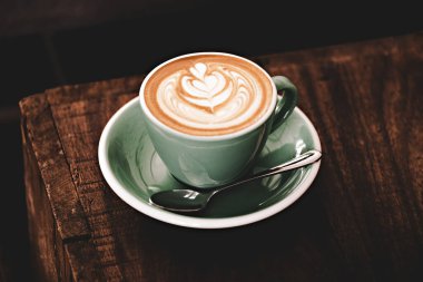 Close up of the cup of cappuccino vintage style