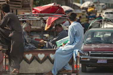 Busy street with cars and people in Chitral district of Khyber Pakhtunkhwa province, Pakistan