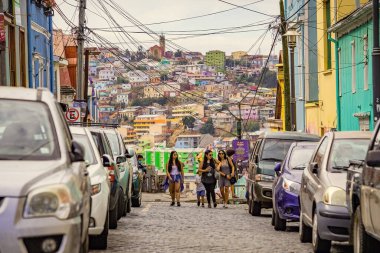 Valparaiso cityscape, colorful houses in Valparaiso, Chile. People on the street of old town