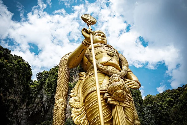 stock image People visiting Batu Caves in Kuala Lumpur city. Giant Murugan statue at the entrance of Batu Caves, Malaysia