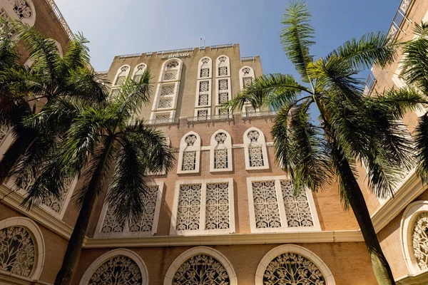 Arabic style historical building with stone carving and palm trees in Putrajaya Malaysia