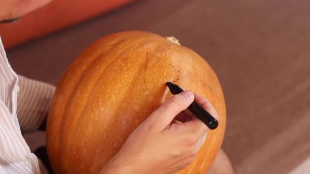 Man Making Halloween Pumpkin Scary Face Carving — Stock Video