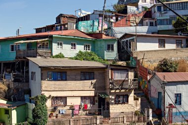 Valparaiso cityscape, colorful houses in Valparaiso, Chile. Old house with a spire against blue sky
