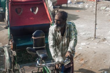 Bangladeshi cycling rickshaw hard work in Bangladesh poor people clipart