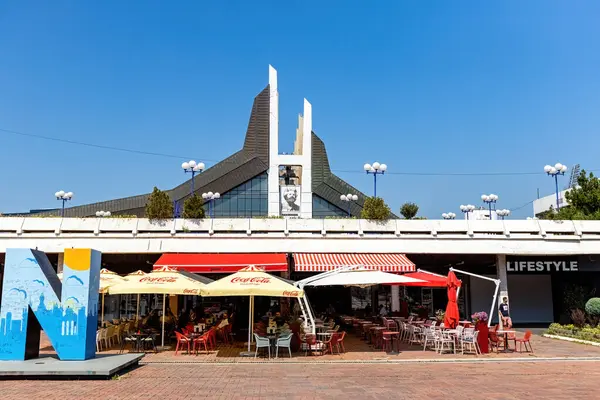 stock image Street cafe and Newborn monument in the center of Pristina towm Kosovo