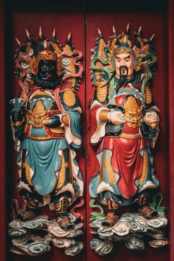 Traditional Chinese temple wooden doors in Tua Pek Kong Temple outside details in Kuching Sarawak Malaysia clipart