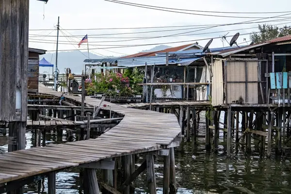 stock image Fishing village houses over the water garbage poor areas in Sabah province in Malaysia