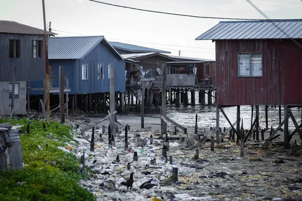 stock image Fishing village houses over the water garbage poor areas in Sabah province in Malaysia