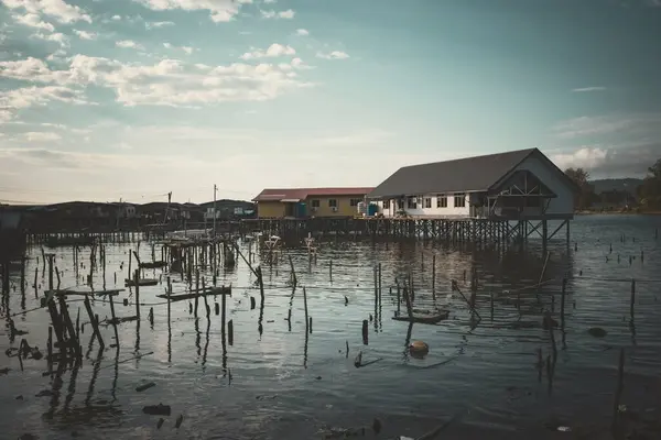 stock image Fishing village houses over the water garbage poor areas in Sabah province in Malaysia