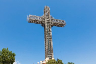 Millenium cross view against blue sky in Skopje North Macedonia clipart