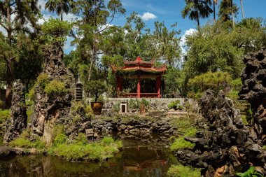 Beautiful Chinese garden in Sam Poh Tong temple hidden in the mountains in Ipoh, Malaysia clipart