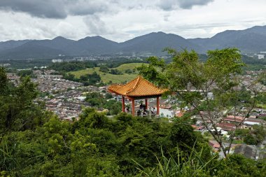 Garden and pagodas at Perak Cave Temple Taoist temple in Ipoh Malaysia clipart