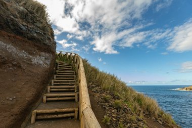 Breathtaking view of the wavy Atlantic ocean from the cliff in Azores islands Portugal clipart