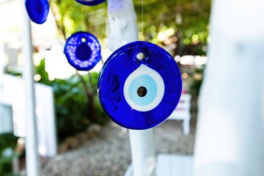 The Turkish eye, also known as the Nazar Boncuk, is a blue glass bead or amulet that is believed to protect against the evil eye clipart