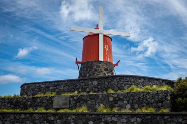 Traditional windmills on Pico island Azores Portugal clipart