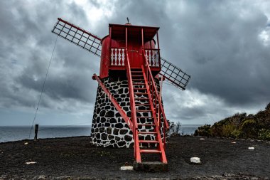 Traditional windmills on Pico island Azores Portugal clipart