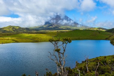 View of the mount Pico from Lagoa do Capitao lake in Pico island Azores Portugal clipart