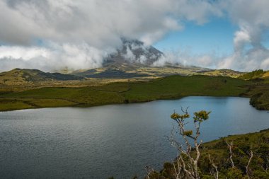 View of the mount Pico from Lagoa do Capitao lake in Pico island Azores Portugal clipart