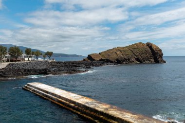 San Roque cliff in the ocean in Sao Roque town Azores San Miguel island Portugal clipart