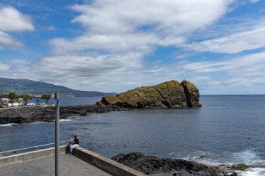 San Roque cliff in the ocean in Sao Roque town Azores San Miguel island Portugal clipart