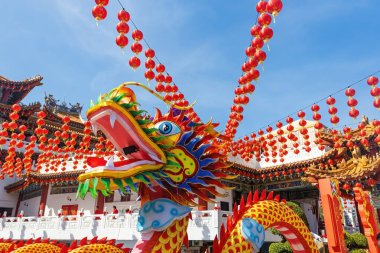 Traditional Chinese dragon installation in Chinese temple with Lunar new year attributes and decoration clipart