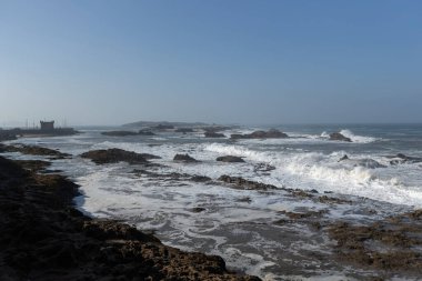 Atlantic ocean view with big waves and cliffs from Essaouira town Morocco clipart