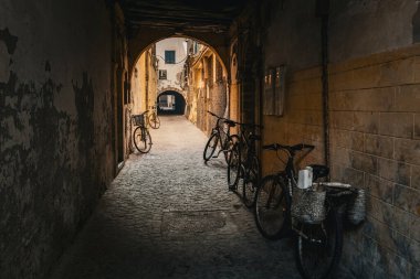 Narrow arch street in old town Medina in Essaouira Morocco clipart