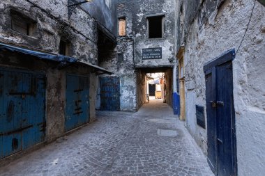 Narrow arch street in old town Medina in Essaouira Morocco clipart