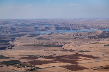 View of the valley and lake at Agafay Desert Morocco clipart