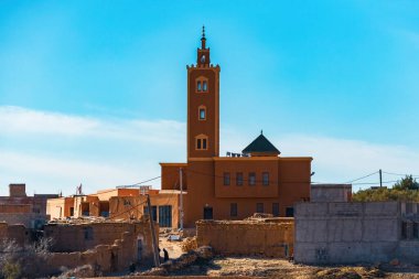 Berber town view with minaret in the center Agafay Desert, Morocco clipart