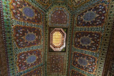 Ornate carvings of the ceiling in Bahia Palace in the Marrakesh Medina old town Morocco clipart