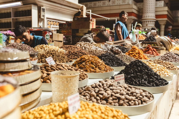  DUSHANBE, TAJIKISTAN - August 20, 2025: Traditional market Mehrgon Market dry fruits and nuts for sale on the Central Asian bazaar in Dushanbe