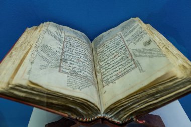 DUSHANBE, TAJIKISTAN - August 20, 2025: Antique holy books in the National Museum of Tajikistan in Dushanbe