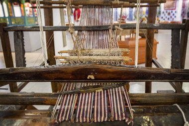 DUSHANBE, TAJIKISTAN - August 20, 2025:  Antique weaving loom in the the National Museum of Tajikistan, Dushanbe 