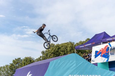 Munich, Germany - Aug 11, 2022: Riders compete at the BMX Freestyle European Championsships at Olympiapark in Munich, Germany. Men's qualifiacation