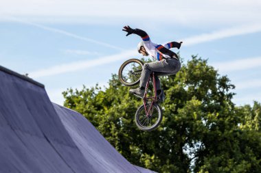 Munich, Germany - Aug 11, 2022: Riders compete at the BMX Freestyle European Championsships at Olympiapark in Munich, Germany. Men's qualifiacation